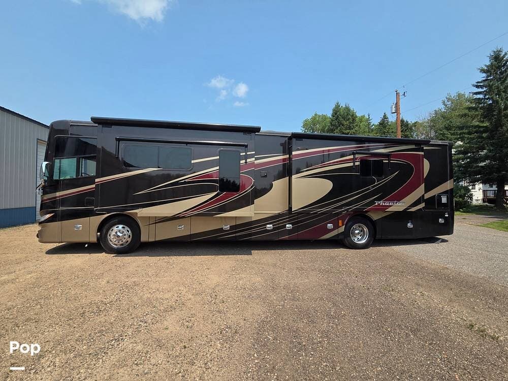 2015 Tiffin Phaeton 40AH - Used Diesel Pusher For Sale by Pop RVs in Hibbing, Minnesota features Generator, Awning, Leveling Jacks, Air Conditioning, Slideout