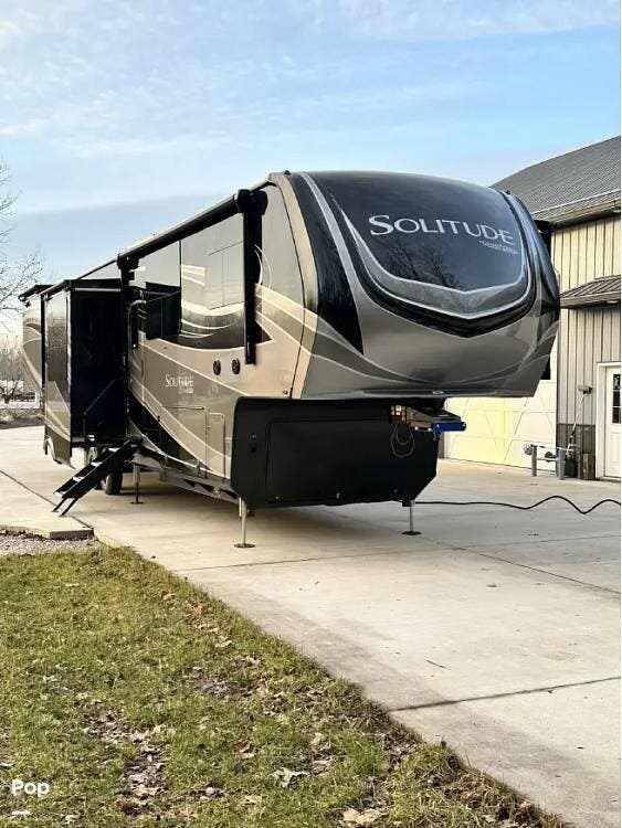 2024 Grand Design Solitude 390RK - Used Fifth Wheel For Sale by Pop RVs in Troy, Indiana features Generator, Leveling Jacks, Air Conditioning, Awning, Slideout