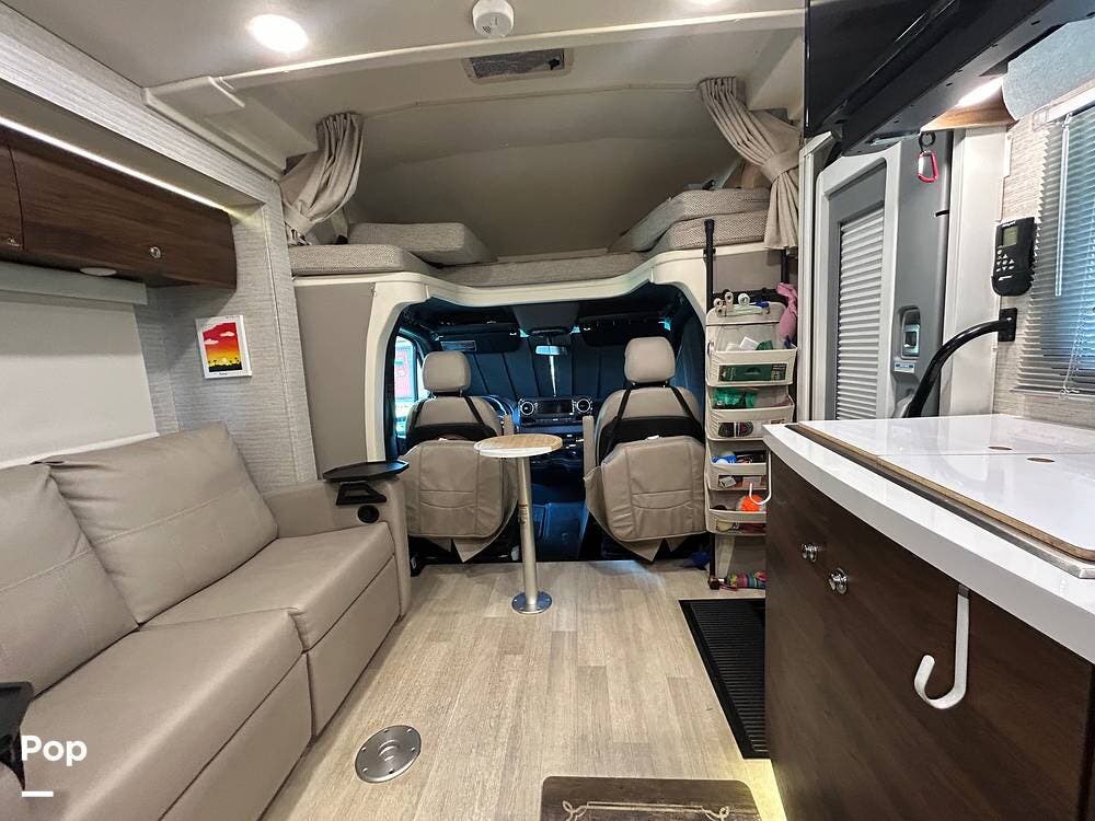 2021 Winnebago Navion 24V - Used Class C For Sale by Pop RVs in Citrus Springs, Florida features Generator, Leveling Jacks, Air Conditioning, Slideout, Awning