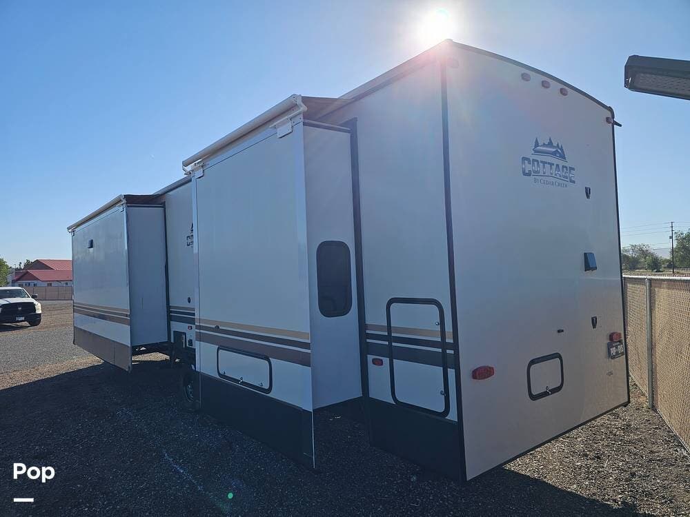 2022 Forest River Cedar Creek 40CCK - Used Travel Trailer For Sale by Pop RVs in Chino Valley, Arizona features Leveling Jacks, Air Conditioning, Slideout, Awning