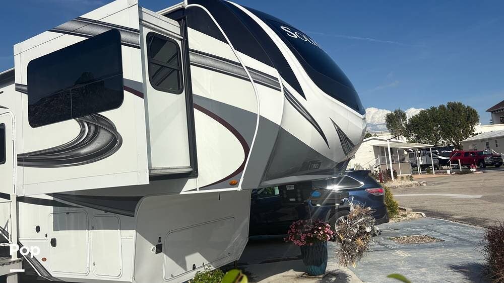 2023 Grand Design Solitude M-380FL - Used Fifth Wheel For Sale by Pop RVs in Fort Myers, Florida features Leveling Jacks, Air Conditioning, Slideout, Awning