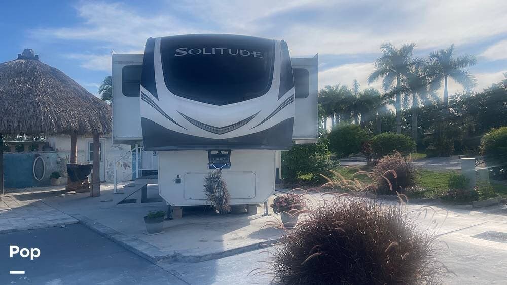 2023 Grand Design Solitude M-380FL - Used Fifth Wheel For Sale by Pop RVs in Fort Myers, Florida features Awning, Leveling Jacks, Air Conditioning, Slideout
