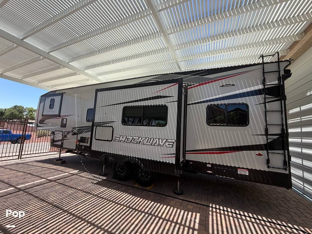 2021 Forest River Shockwave 30FWGDX - Used Toy Hauler For Sale by Pop RVs in Logandale, Nevada features Leveling Jacks, Slideout, Generator, Air Conditioning
