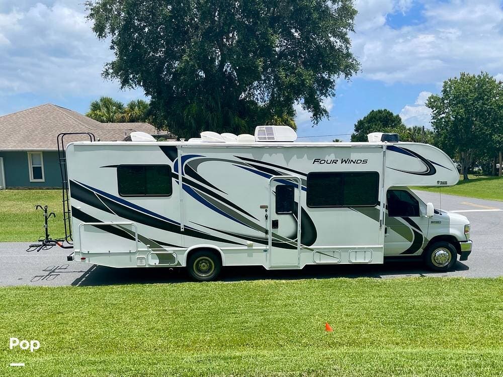 2021 Thor Motor Coach Four Winds 28Z - Used Class C For Sale by Pop RVs in Sebastian, Florida features Awning, Slideout, Air Conditioning, Generator