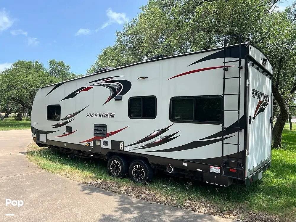2018 Forest River Shockwave 24RQMX - Used Toy Hauler For Sale by Pop RVs in Georgetown, Texas features Generator, Leveling Jacks, Awning, Air Conditioning