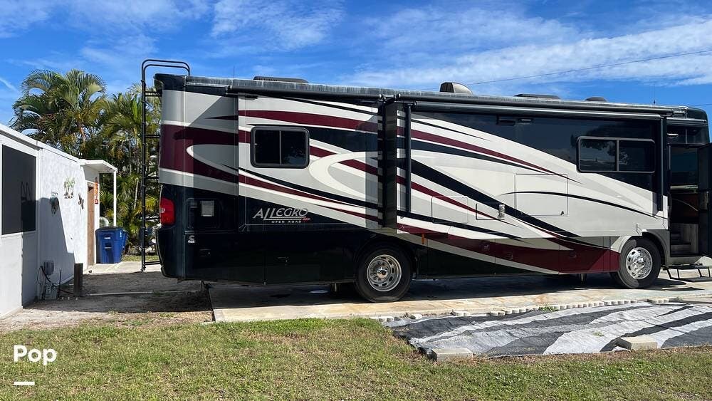 2013 Tiffin Allegro Red 34QFA - Used Diesel Pusher For Sale by Pop RVs in Saint James City, Florida features Generator, Air Conditioning, Leveling Jacks, Awning, Slideout