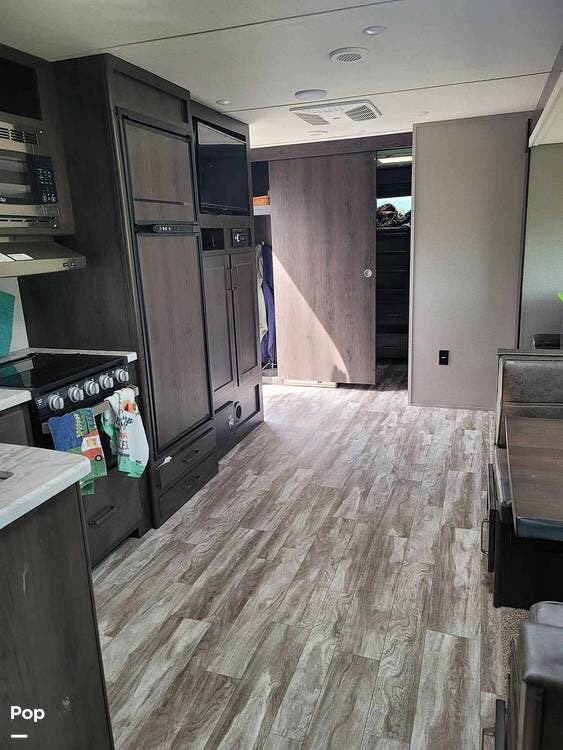 2021 Grand Design Transcend M-32BHS - Used Travel Trailer For Sale by Pop RVs in Pueblo, Colorado features Leveling Jacks, Slideout, Air Conditioning, Awning