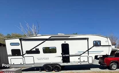 2025 Cherokee Arctic Wolf 278BHS - Used Fifth Wheel For Sale by Pop RVs in Indian Trail, North Carolina features Slideout