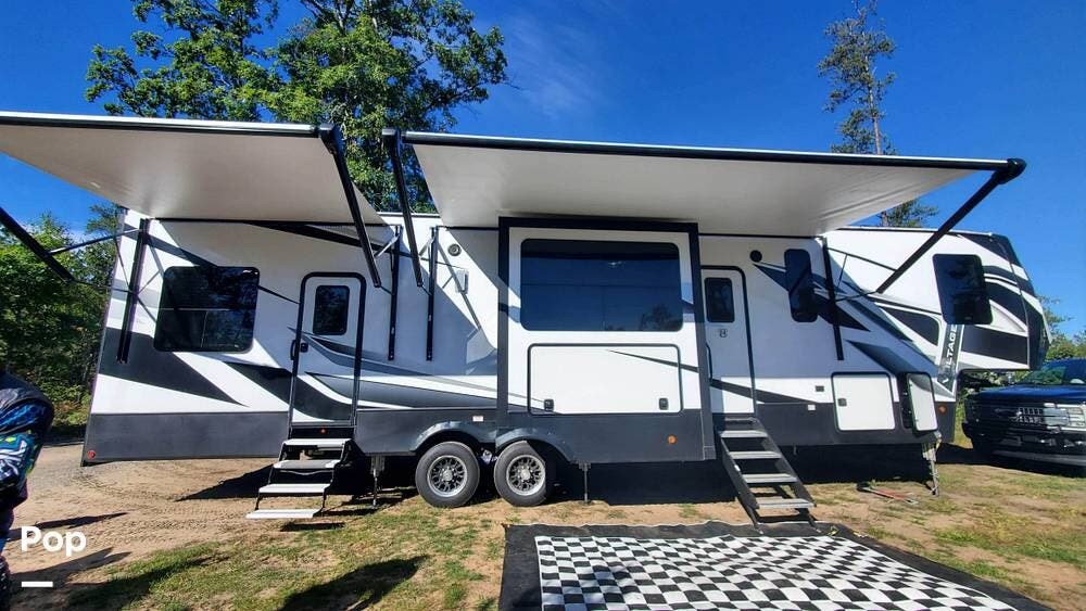 2021 Dutchmen Voltage 3845 - Used Toy Hauler For Sale by Pop RVs in Lawton, Michigan features Slideout, Air Conditioning, Generator, Leveling Jacks, Awning