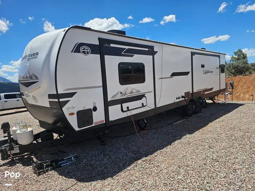 2025 Forest River Grand Surveyor 305RLBS - Used Travel Trailer For Sale by Pop RVs in Carbondale, Colorado features Awning, Air Conditioning, Leveling Jacks, Slideout