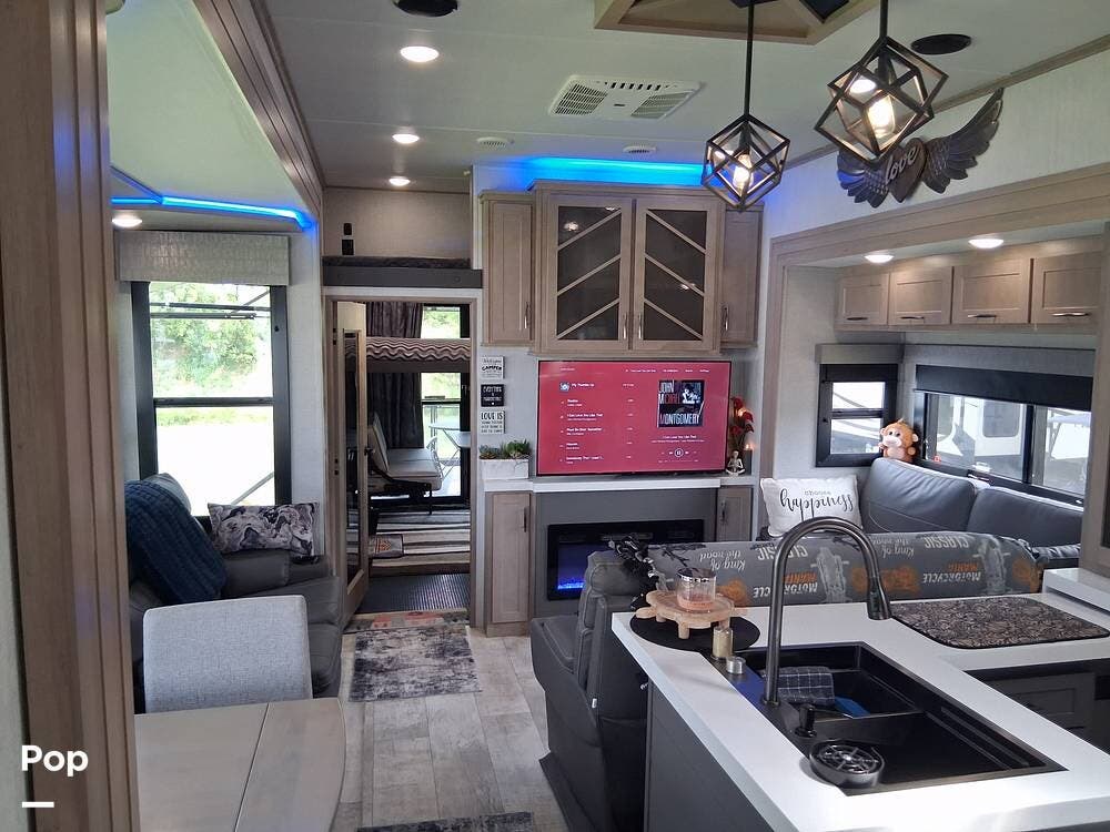 2024 Grand Design Momentum 395MS - Used Toy Hauler For Sale by Pop RVs in Howell, Michigan features Leveling Jacks, Generator, Air Conditioning, Awning, Slideout