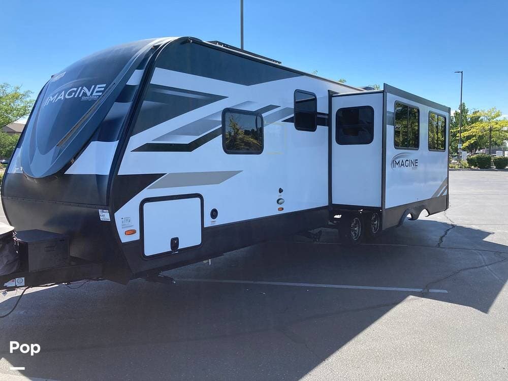2022 Grand Design Imagine 2910BH - Used Travel Trailer For Sale by Pop RVs in Meridian, Idaho features Air Conditioning, Leveling Jacks, Awning, Slideout