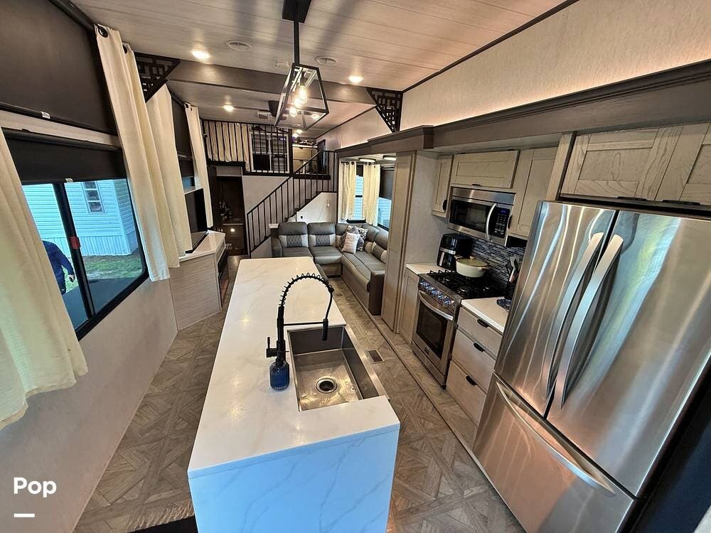2024 Forest River Wildwood Grand Lodge 44VIEW - Used Travel Trailer For Sale by Pop RVs in Orlando, Florida features Slideout, Air Conditioning, Leveling Jacks, Awning