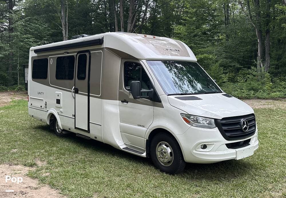 2022 Leisure Travel Unity U24FX - Used Class B+ For Sale by Pop RVs in Kalkaska, Michigan features Leveling Jacks, Air Conditioning, Slideout, Awning, Generator
