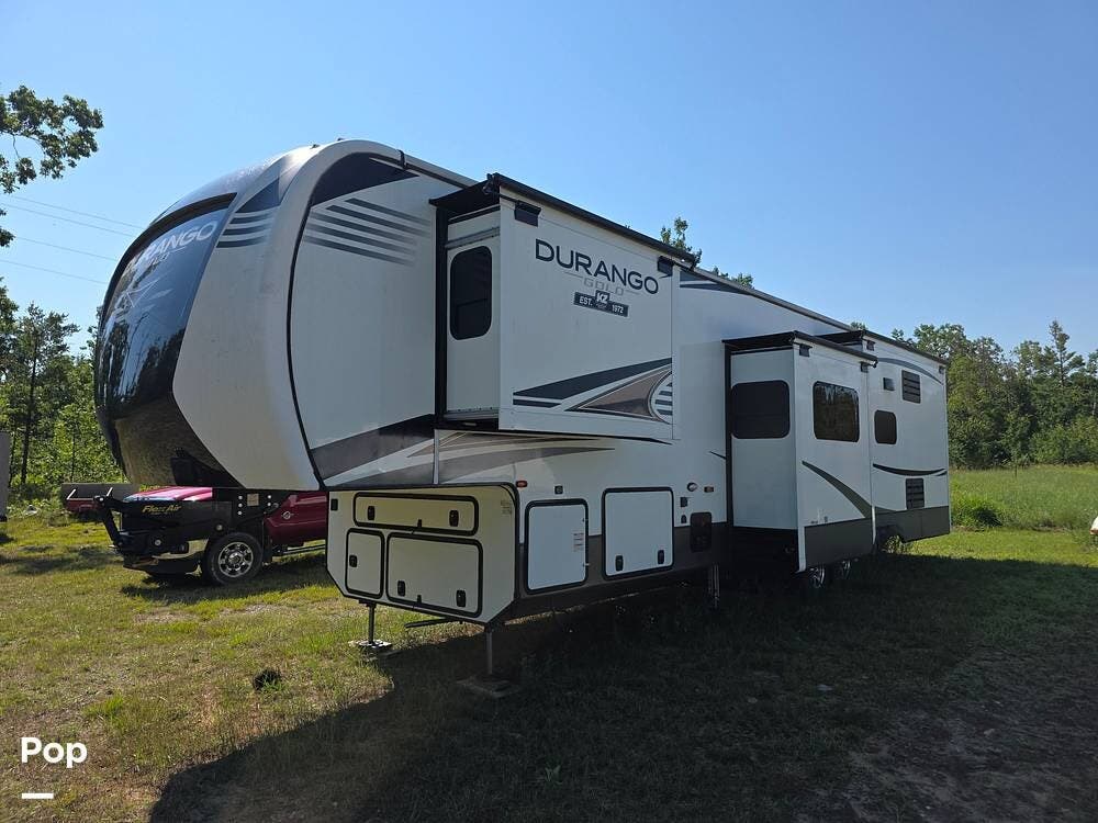 2021 K-Z Durango Gold 382MBQ - Used Fifth Wheel For Sale by Pop RVs in Hillman, Michigan features Awning, Generator, Air Conditioning, Slideout