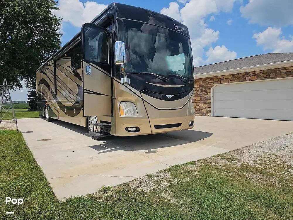 2015 Fleetwood Discovery 40E - Used Diesel Pusher For Sale by Pop RVs in Ainsworth, Iowa features Awning, Slideout, Air Conditioning, Generator, Leveling Jacks