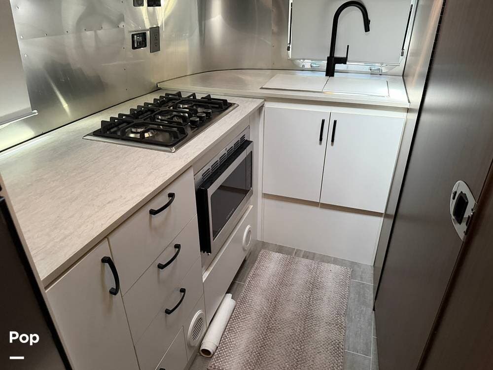 2021 Airstream Caravel 20FB - Used Travel Trailer For Sale by Pop RVs in Madisonville, Louisiana features Awning, Air Conditioning, Leveling Jacks