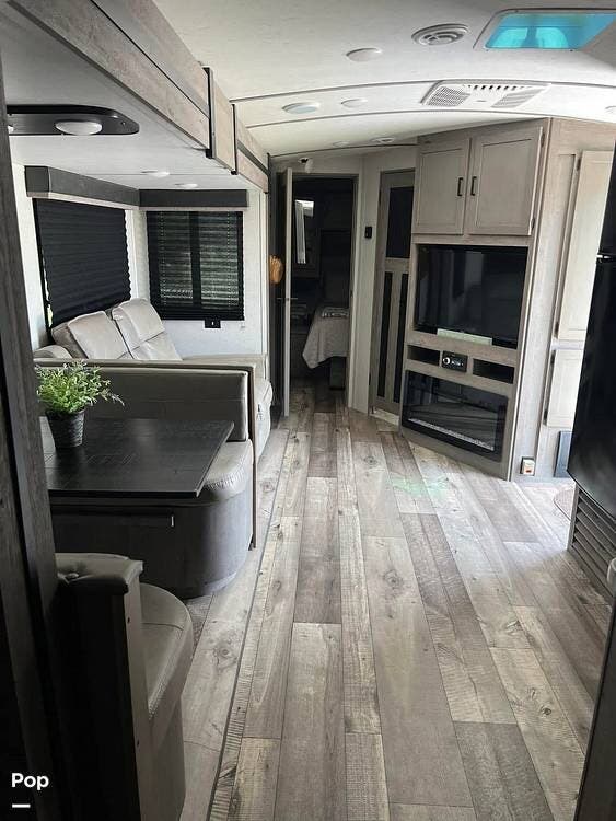 2021 Keystone Outback Ultra Lite 302 UBH - Used Travel Trailer For Sale by Pop RVs in Loxahatchee, Florida features Slideout