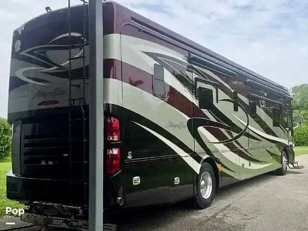 2013 Tiffin Allegro Bus 40QBP Power Glide - Used Diesel Pusher For Sale by Pop RVs in Miami, Florida features Leveling Jacks, Awning, Generator, Slideout, Air Conditioning