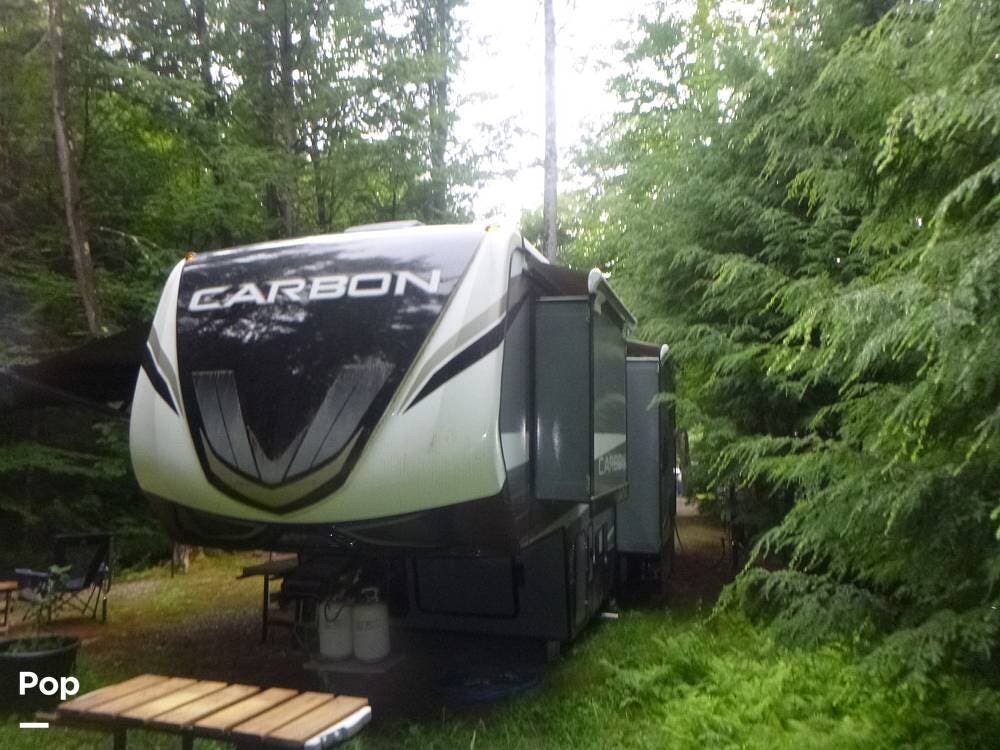 2020 Keystone Carbon 358 - Used Toy Hauler For Sale by Pop RVs in Newport, New Hampshire features Air Conditioning, Generator, Awning, Slideout, Leveling Jacks