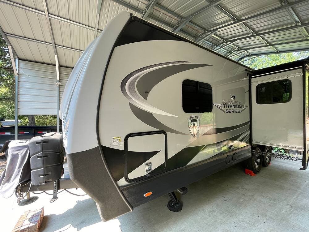 2023 Outdoors RV Timber Ridge 24RKS Titanium Series - Used Travel Trailer For Sale by Pop RVs in Sequim, Washington features Slideout, Air Conditioning, Leveling Jacks, Awning