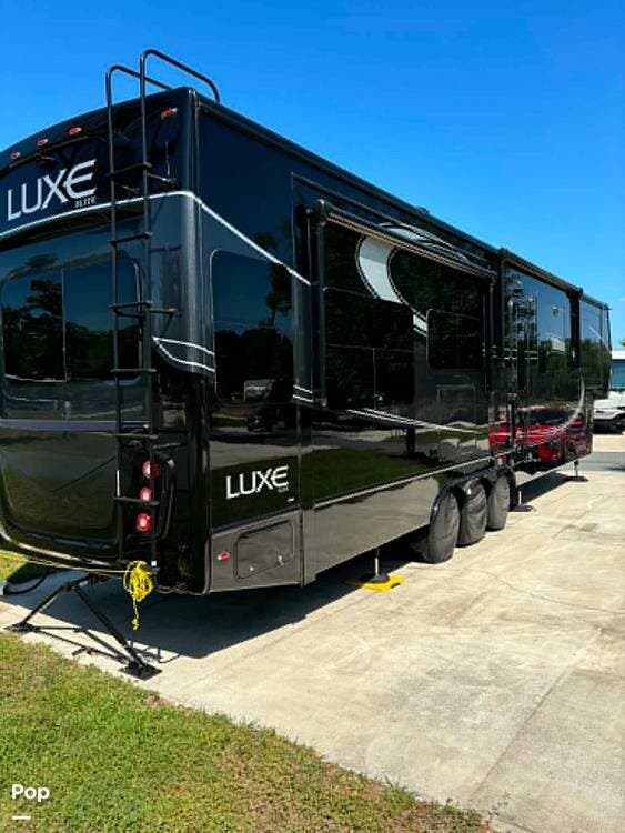 2023 Luxe Elite by The RV Factory 42MD  Series - Used Fifth Wheel For Sale by Pop RVs in Fort Ripley, Minnesota features Slideout, Air Conditioning, Leveling Jacks