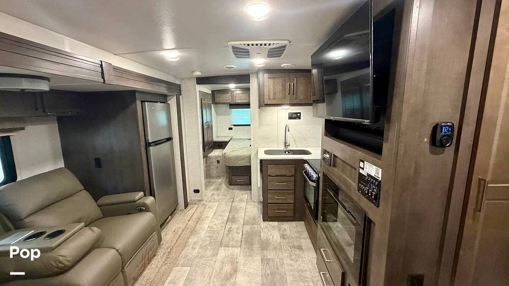 2021 Forest River Micro Lite 25FBLS - Used Travel Trailer For Sale by Pop RVs in Willis, Texas features Awning, Slideout, Air Conditioning, Leveling Jacks
