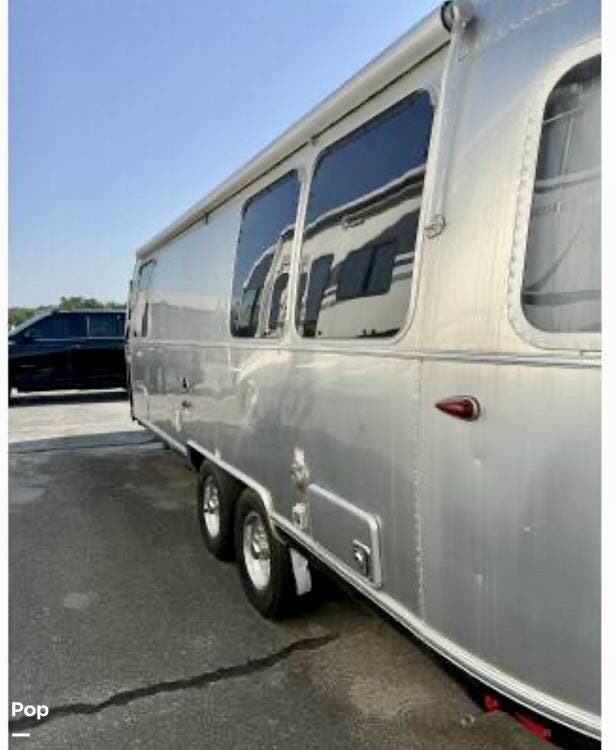 2023 Airstream International 25FB Twin - Used Travel Trailer For Sale by Pop RVs in Springdale, Arkansas features Awning, Air Conditioning, Leveling Jacks