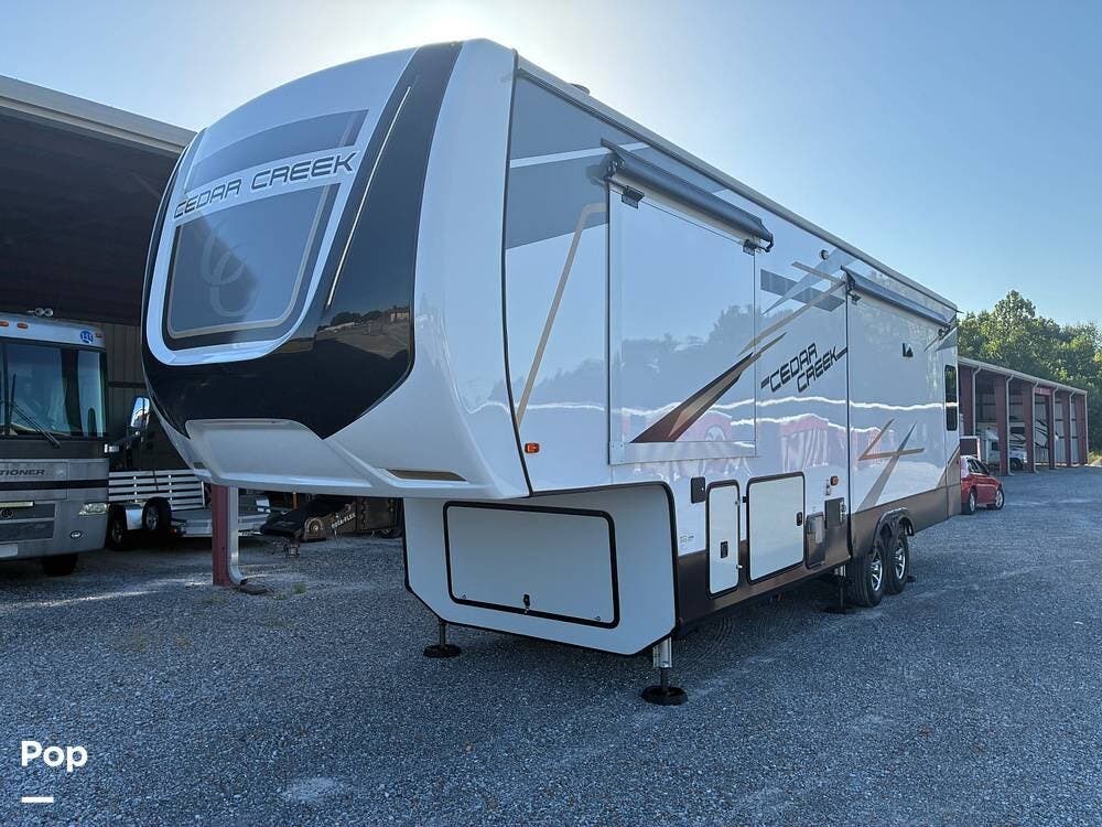 2023 Forest River Cedar Creek 311RL - Used Fifth Wheel For Sale by Pop RVs in Paducah, Kentucky features Slideout, Leveling Jacks, Awning, Air Conditioning