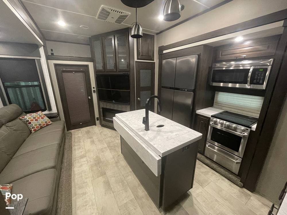 2021 Grand Design Momentum 351M - Used Toy Hauler For Sale by Pop RVs in Kaplan, Louisiana features Air Conditioning, Generator, Leveling Jacks, Slideout, Awning