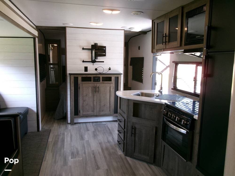 2022 Heartland Pioneer QB300 - Used Travel Trailer For Sale by Pop RVs in Port St Lucie, Florida features Slideout, Awning, Air Conditioning