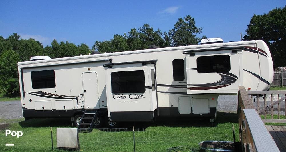 2019 Forest River Cedar Creek 37RTH - Used Toy Hauler For Sale by Pop RVs in Berlin, Maryland features Leveling Jacks, Slideout, Air Conditioning, Awning