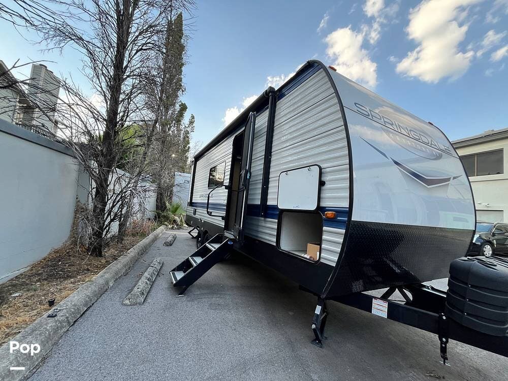2025 Keystone Springdale 220ML - Used Travel Trailer For Sale by Pop RVs in San Antonio, Texas features Slideout, Awning, Leveling Jacks, Air Conditioning