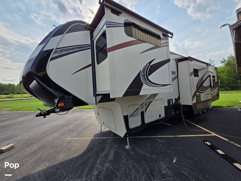 2015 Grand Design Momentum 385TH - Used Toy Hauler For Sale by Pop RVs in Elma, New York features Slideout, Air Conditioning, Generator, Leveling Jacks, Awning