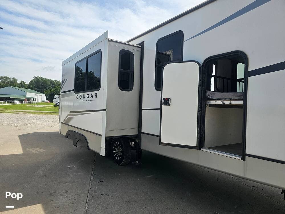 2023 Keystone Cougar 30BHS - Used Travel Trailer For Sale by Pop RVs in Colfax, Iowa features Awning, Slideout, Air Conditioning, Leveling Jacks