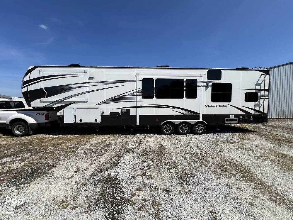 2015 Dutchmen Voltage 3990 - Used Toy Hauler For Sale by Pop RVs in New Palestine, Indiana features Leveling Jacks, Air Conditioning, Slideout, Awning, Generator