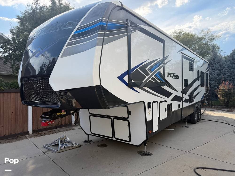 2021 Keystone Fuzion 373 - Used Toy Hauler For Sale by Pop RVs in Highland, Utah features Awning, Air Conditioning, Leveling Jacks, Generator, Slideout