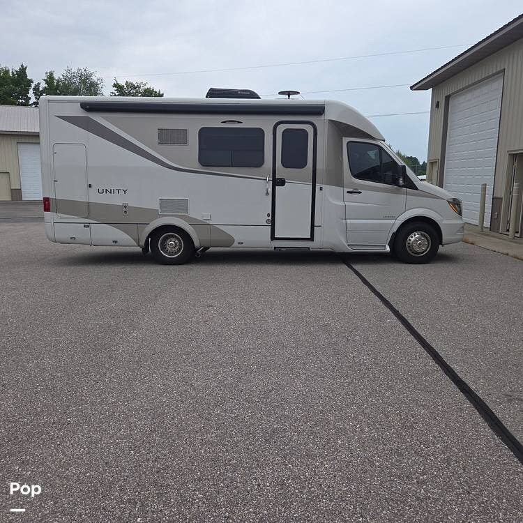 2015 Leisure Travel Unity U24MB - Used Class C For Sale by Pop RVs in Boyne City, Michigan features Awning, Generator, Air Conditioning, Slideout, Leveling Jacks