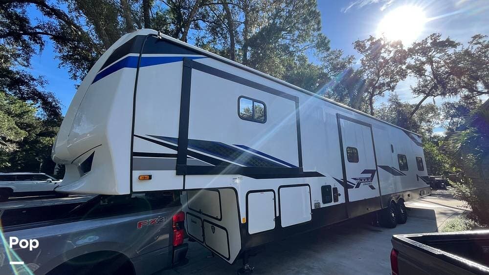 2024 Forest River Rogue Armored 383G2 - Used Toy Hauler For Sale by Pop RVs in Bradenton, Florida features Awning, Slideout, Air Conditioning, Generator