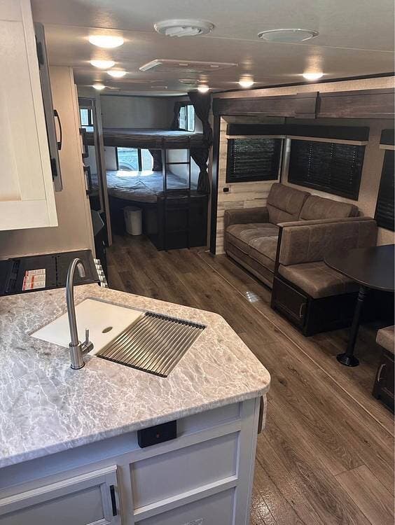 2021 Jayco Jay Feather 27BHB - Used Travel Trailer For Sale by Pop RVs in Houma, Louisiana features Awning, Slideout, Leveling Jacks, Air Conditioning