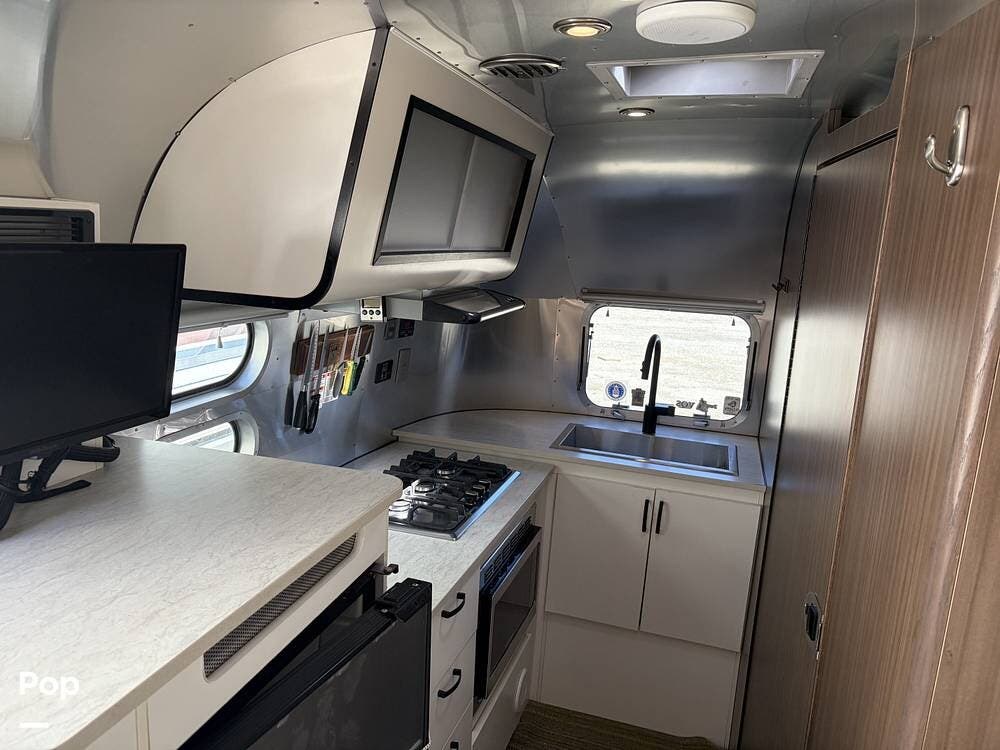 2021 Airstream Caravel 20FB - Used Travel Trailer For Sale by Pop RVs in Desert Hot Springs, California features Air Conditioning, Leveling Jacks, Awning
