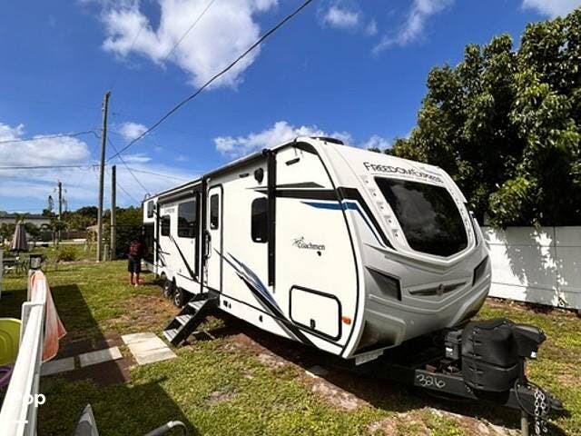 2022 Forest River Coachmen Freedom Express Liberty 320 BHDS LE - Used Travel Trailer For Sale by Pop RVs in Venice, Florida features Slideout