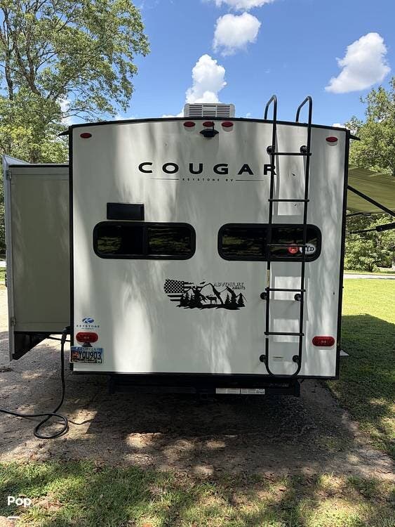 2023 Keystone Cougar 23MLE - Used Travel Trailer For Sale by Pop RVs in Fayetteville, Georgia features Awning, Leveling Jacks, Slideout, Air Conditioning