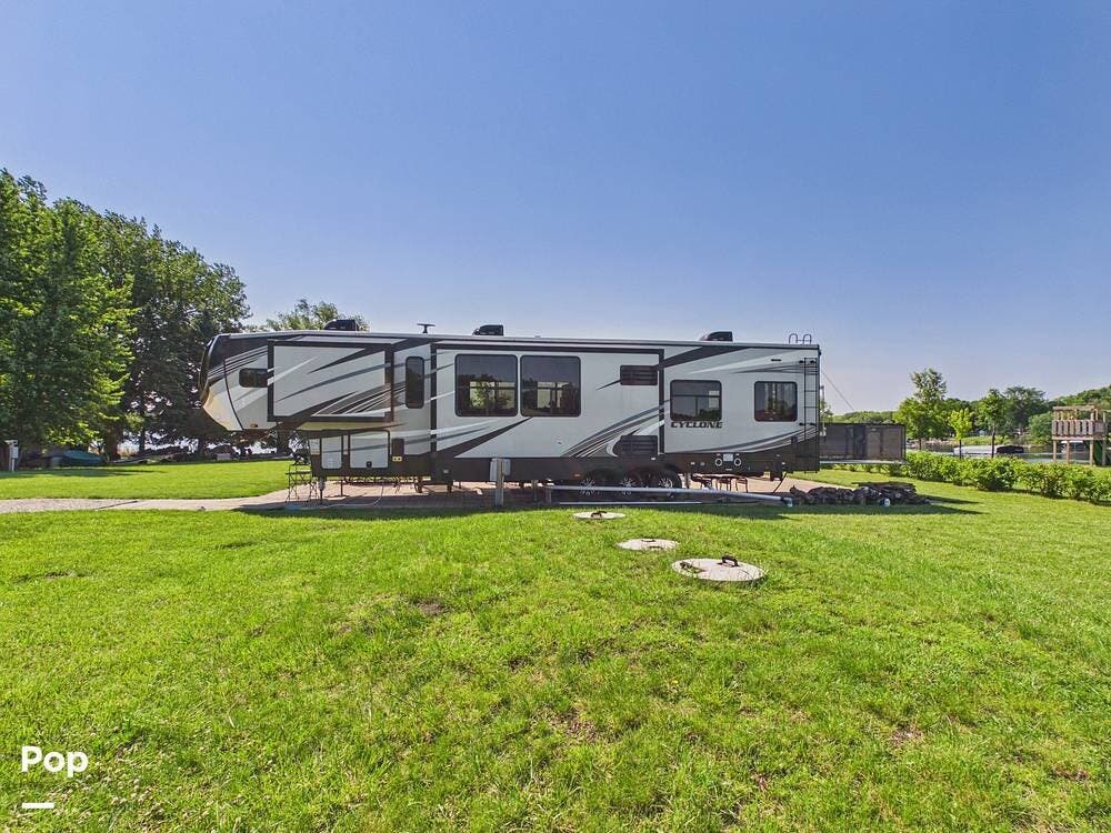 2019 Heartland Cyclone 4270 - Used Toy Hauler For Sale by Pop RVs in Little Falls, Minnesota features Awning, Slideout, Air Conditioning, Generator, Leveling Jacks