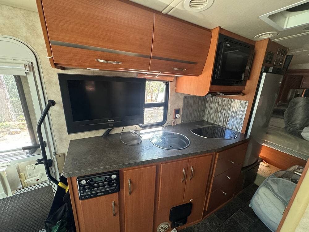 2011 Itasca Navion iQ 24G - Used Class C For Sale by Pop RVs in Scotts Valley, California features Air Conditioning, Awning, Generator, Slideout