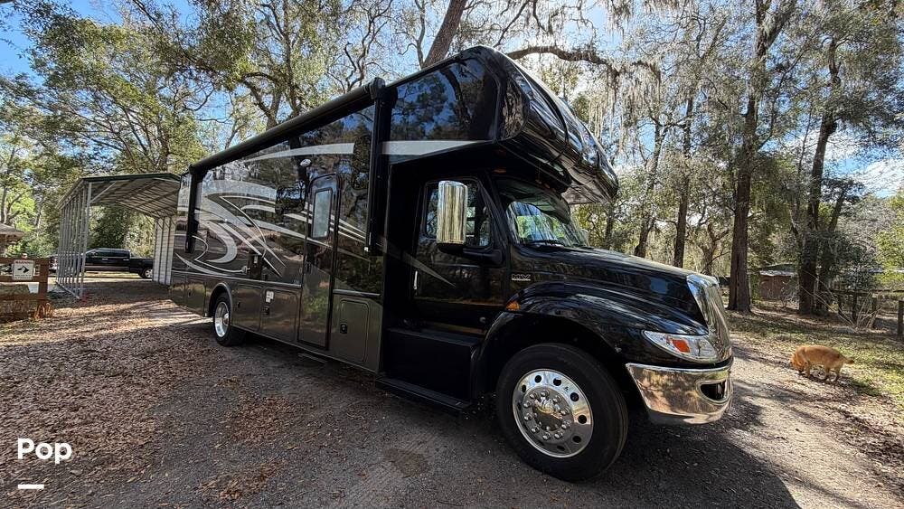 2023 Nexus Wraith 32W - Used Super C For Sale by Pop RVs in Dade City, Florida features Generator, Leveling Jacks, Slideout, Awning, Air Conditioning