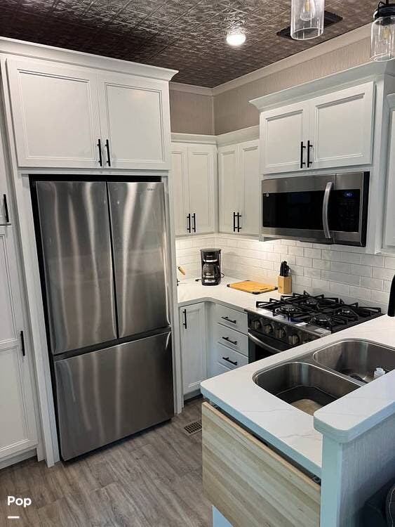 2022 Forest River RiverStone Reserve 3850RK - Used Fifth Wheel For Sale by Pop RVs in Harrietta, Michigan features Slideout