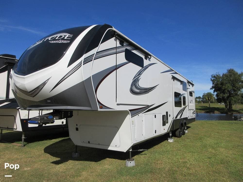 2021 Grand Design Solitude 390RK - Used Fifth Wheel For Sale by Pop RVs in Lithia, Florida features Slideout, Awning, Leveling Jacks, Generator, Air Conditioning