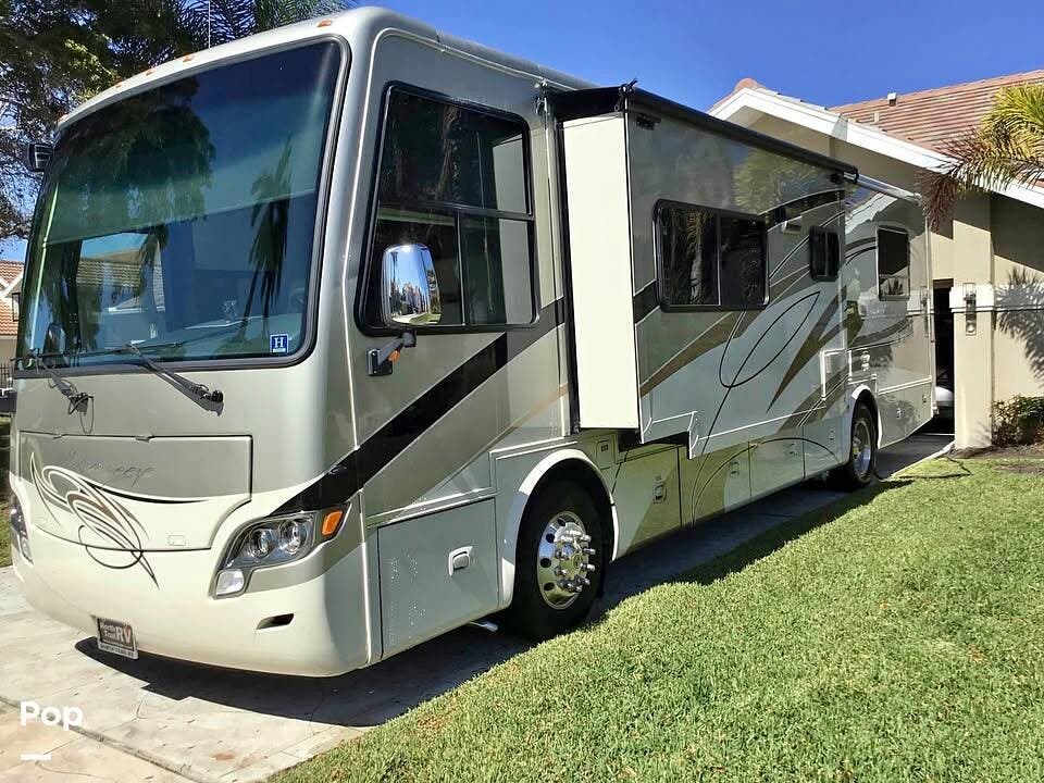 2012 Tiffin Allegro Breeze 32BR - Used Diesel Pusher For Sale by Pop RVs in Fort Myers, Florida features Generator, Awning, Leveling Jacks, Slideout, Air Conditioning