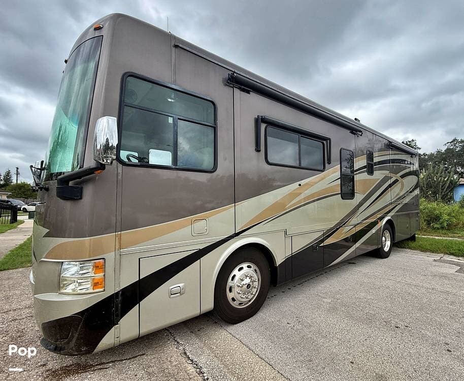 2013 Tiffin Allegro Red 33AA - Used Diesel Pusher For Sale by Pop RVs in Ocoee, Florida features Generator, Air Conditioning, Awning, Slideout, Leveling Jacks